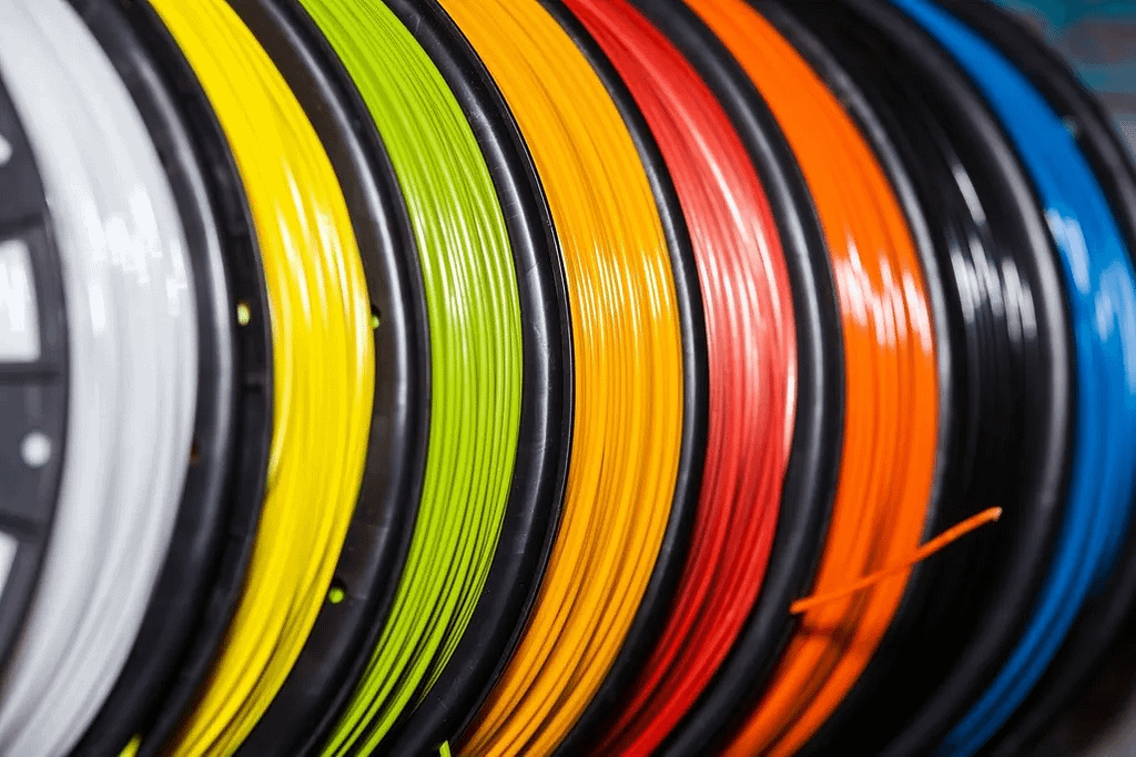 Different coloured plastic filaments for 3D printing